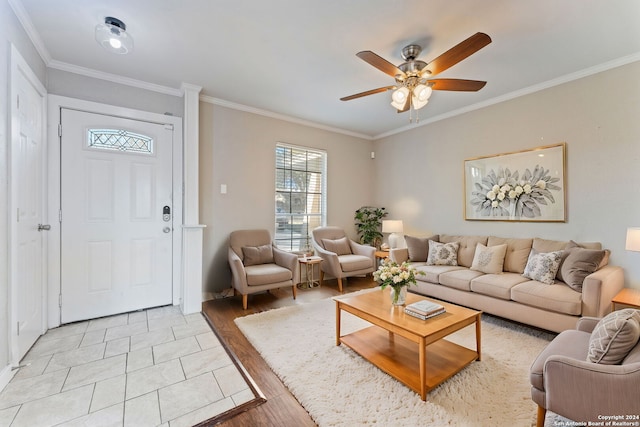 living room featuring light wood-type flooring, ceiling fan, and ornamental molding