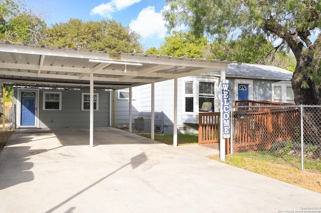 rear view of house featuring a carport