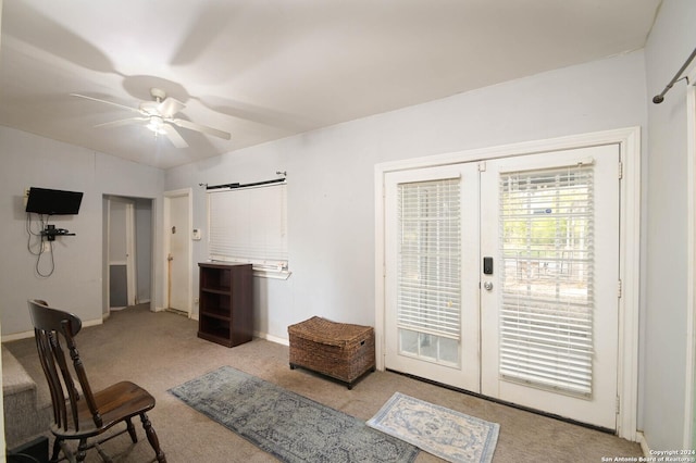 interior space featuring ceiling fan, light carpet, and french doors