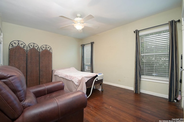 bedroom with ceiling fan and dark wood-type flooring