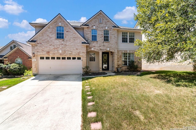 front facade featuring a front yard and a garage