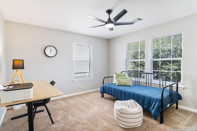 bedroom with light carpet and ceiling fan