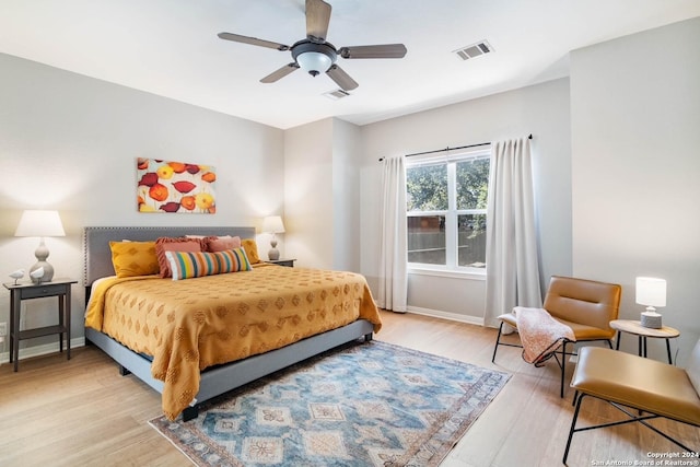 bedroom featuring light hardwood / wood-style flooring and ceiling fan