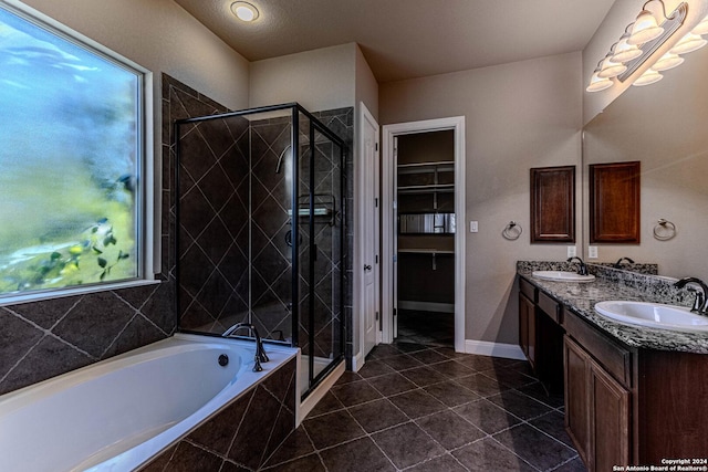 bathroom featuring tile patterned flooring, vanity, and independent shower and bath