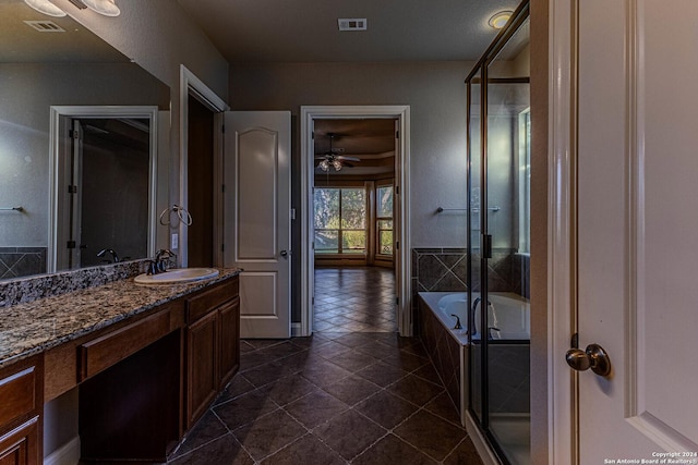 bathroom featuring ceiling fan, tile patterned flooring, vanity, and independent shower and bath