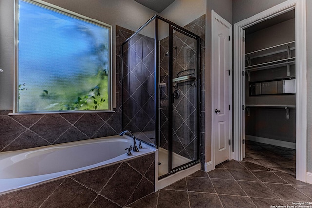 bathroom with tile patterned flooring and independent shower and bath