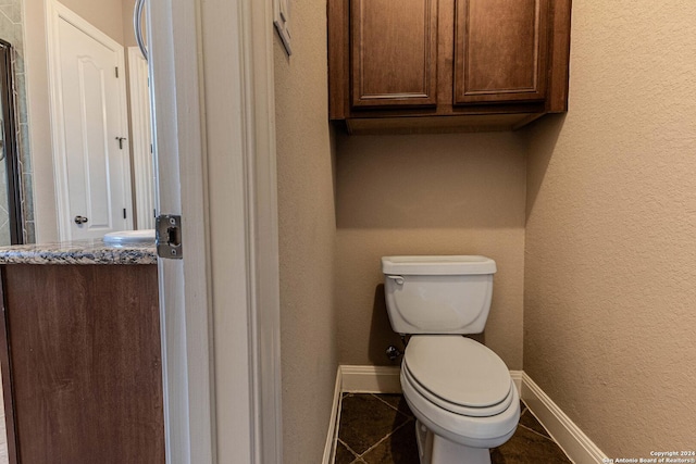 bathroom featuring tile patterned floors and toilet