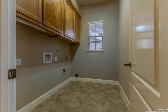 laundry room featuring cabinets, washer hookup, hookup for an electric dryer, hookup for a gas dryer, and light tile patterned floors