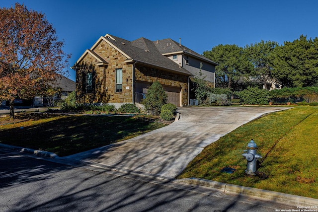 view of front facade with a garage and a front yard