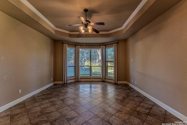 unfurnished room featuring a tray ceiling, crown molding, and ceiling fan