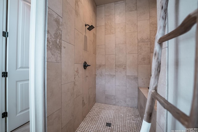 bathroom with tiled shower