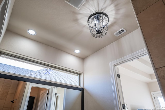 interior details with an inviting chandelier