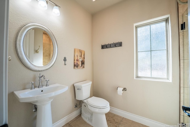 bathroom featuring tile patterned floors and toilet