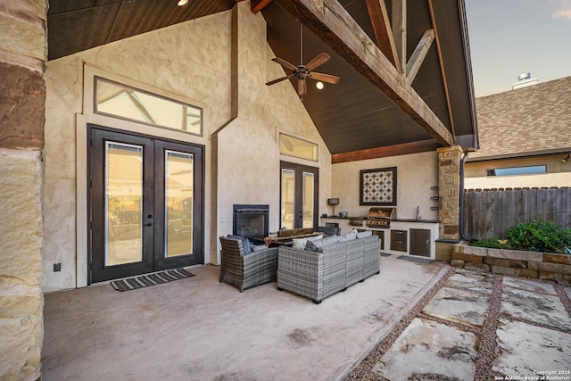 view of patio / terrace featuring ceiling fan, french doors, exterior kitchen, a grill, and an outdoor hangout area