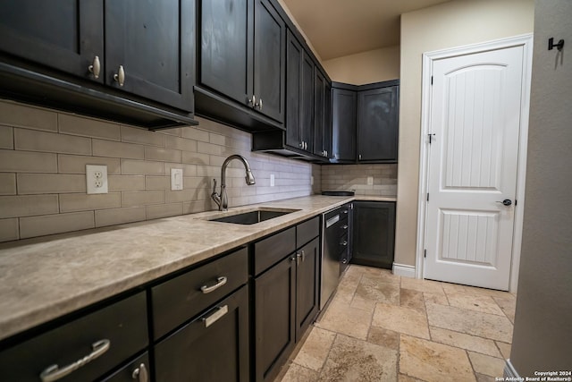 kitchen with decorative backsplash, dishwasher, sink, and light stone countertops