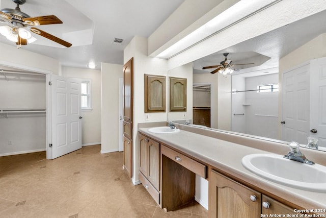 bathroom featuring tile patterned flooring, ceiling fan, and a wealth of natural light