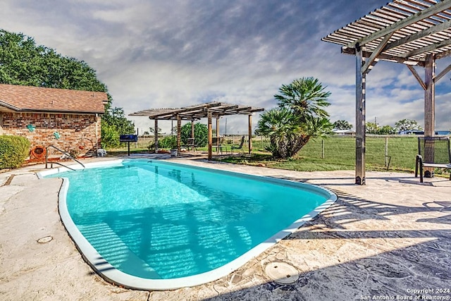 view of swimming pool featuring a pergola and a patio