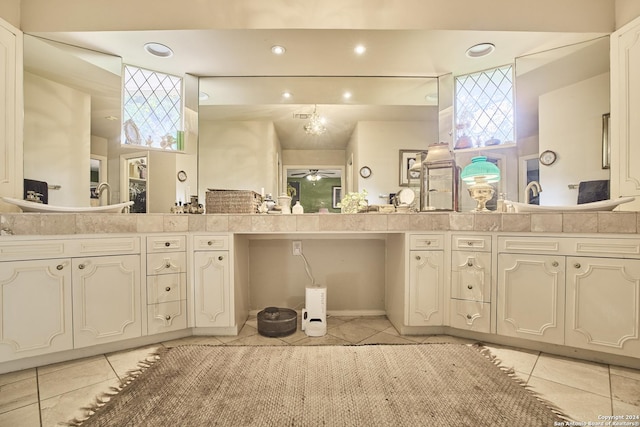 bathroom featuring tile patterned flooring, vanity, and ceiling fan