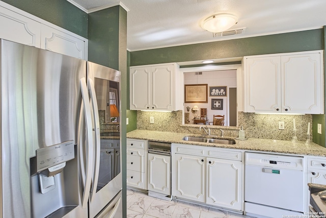 kitchen with white dishwasher, white cabinets, sink, and stainless steel refrigerator with ice dispenser