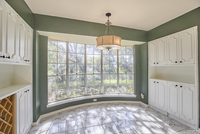 unfurnished dining area featuring a healthy amount of sunlight