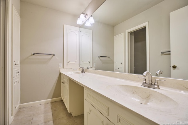 bathroom with tile patterned floors and vanity