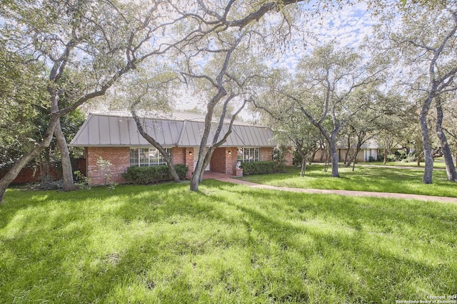 ranch-style house with a front lawn