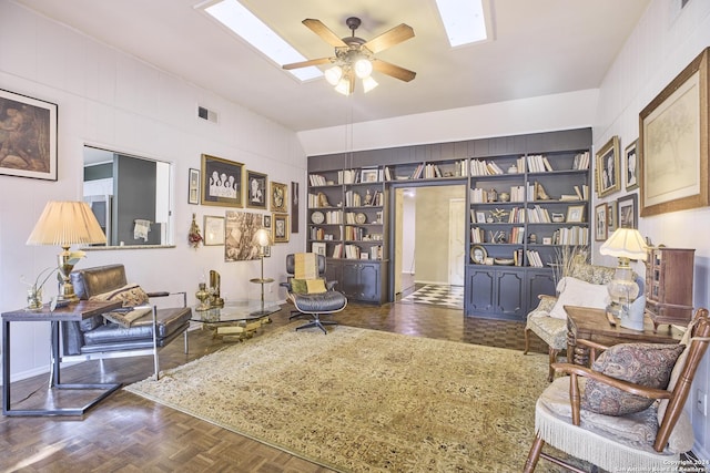 sitting room featuring dark parquet floors and ceiling fan