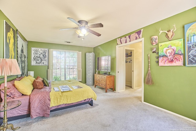 bedroom featuring ceiling fan and carpet