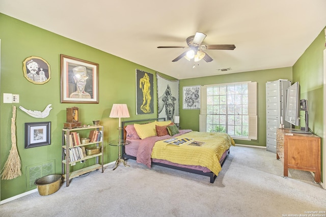 bedroom featuring ceiling fan and light colored carpet