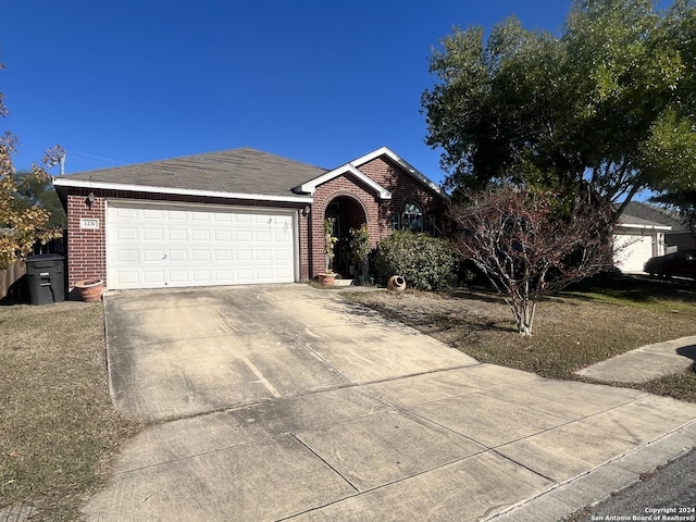 ranch-style house featuring a garage