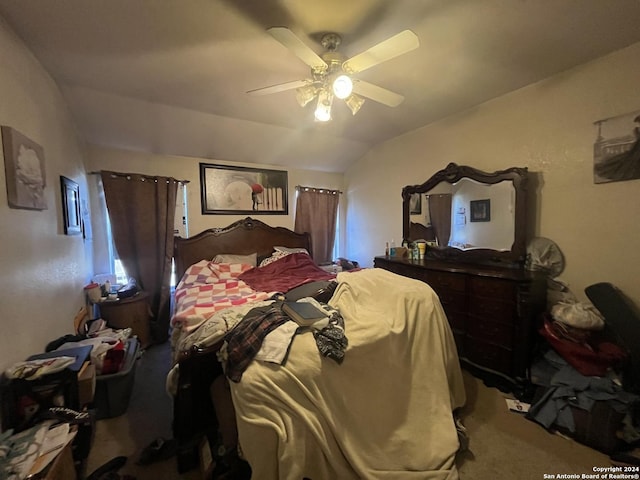 bedroom with carpet, vaulted ceiling, and ceiling fan