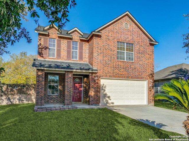 view of front property with a garage and a front lawn