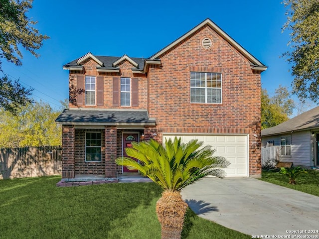 view of front property featuring a front yard and a garage