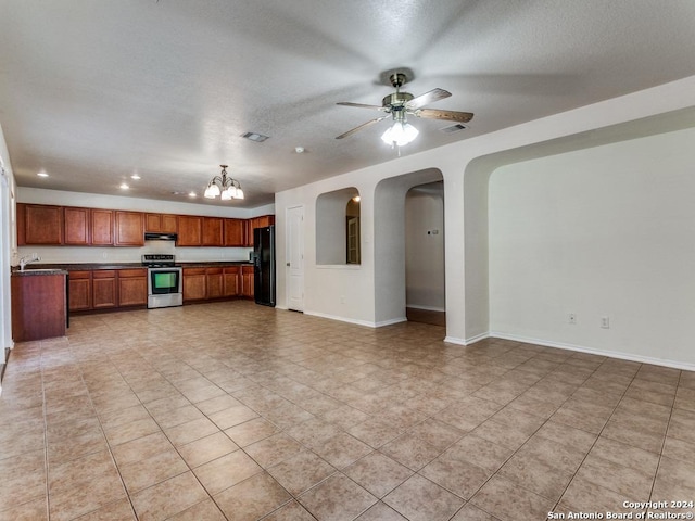 unfurnished living room featuring a textured ceiling, sink, light tile patterned floors, and ceiling fan with notable chandelier