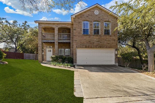 view of front property featuring a front yard, a balcony, and a garage