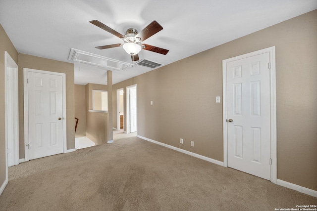 empty room with light carpet and ceiling fan