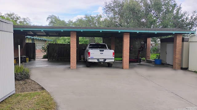 view of parking / parking lot with a carport