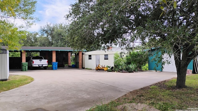 exterior space featuring an outdoor structure and a carport