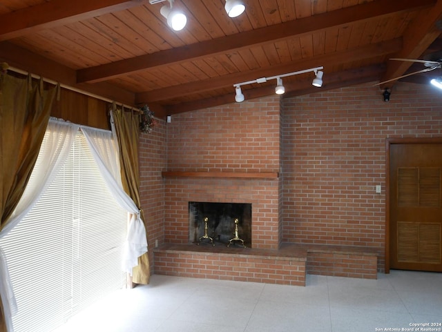 unfurnished living room featuring lofted ceiling with beams, wooden ceiling, and a fireplace