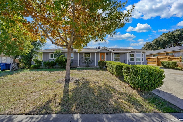 ranch-style home with a front yard