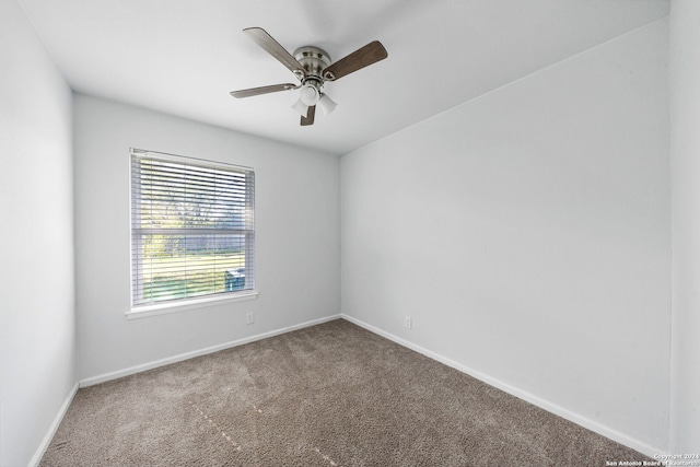 unfurnished room featuring ceiling fan and carpet floors