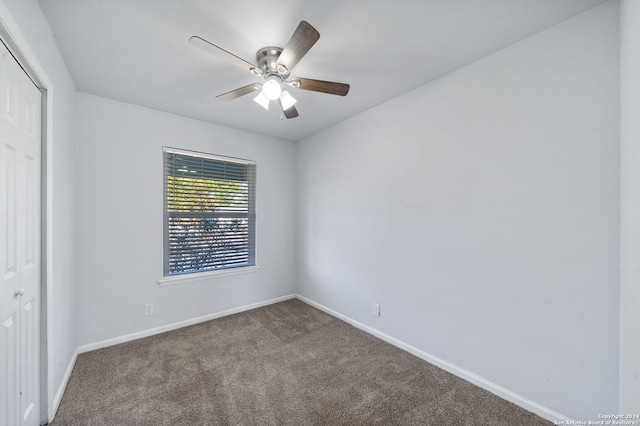 carpeted empty room with ceiling fan