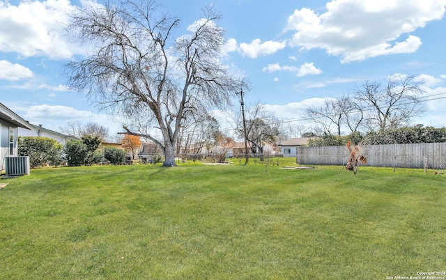 view of yard with central AC