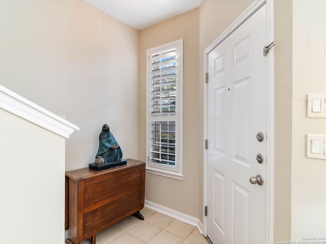 entrance foyer featuring light tile patterned flooring