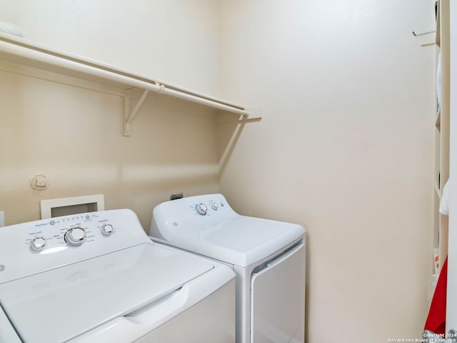 laundry area with washing machine and dryer