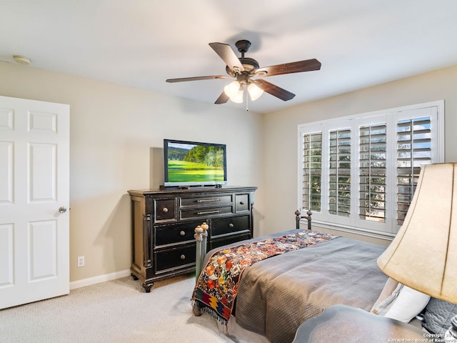 bedroom with ceiling fan and light colored carpet