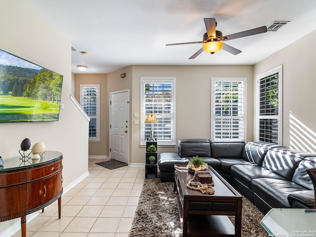 tiled living room featuring ceiling fan