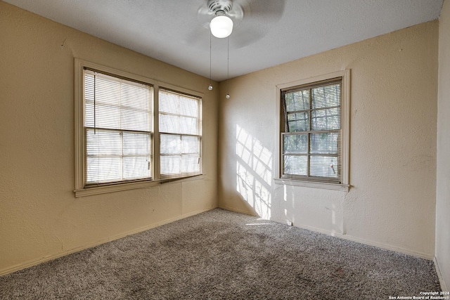 unfurnished room with carpet flooring and ceiling fan