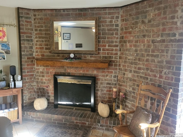 interior details featuring a brick fireplace