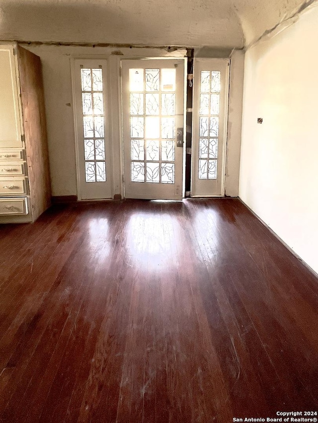 spare room featuring dark hardwood / wood-style flooring